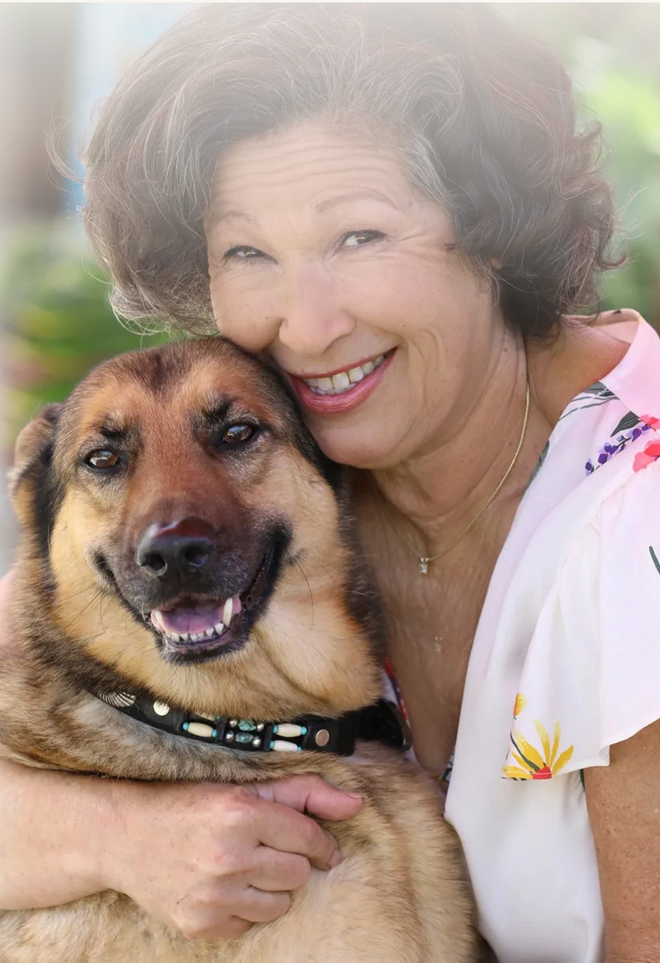 Founder Anita St Lewis hugging a rescued dog